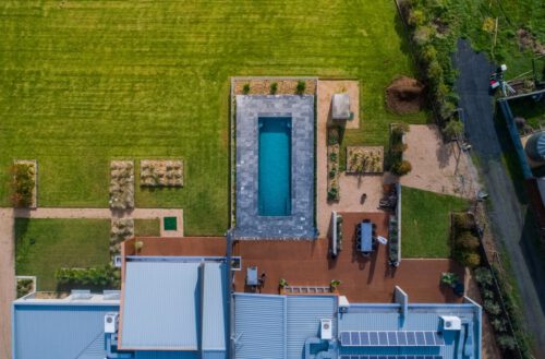 Compass Pools Australia Beautifully Landscaped Backyard With X Trainer Pool As Its Centrepiece