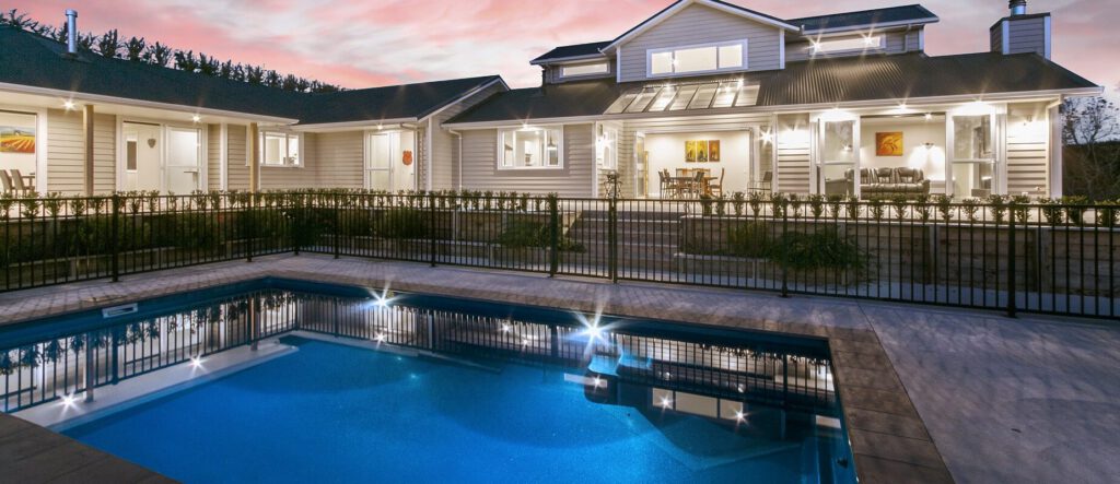 Compass Pools Australia X Trainer Bi Luminite Pool With Lights On By Sunset